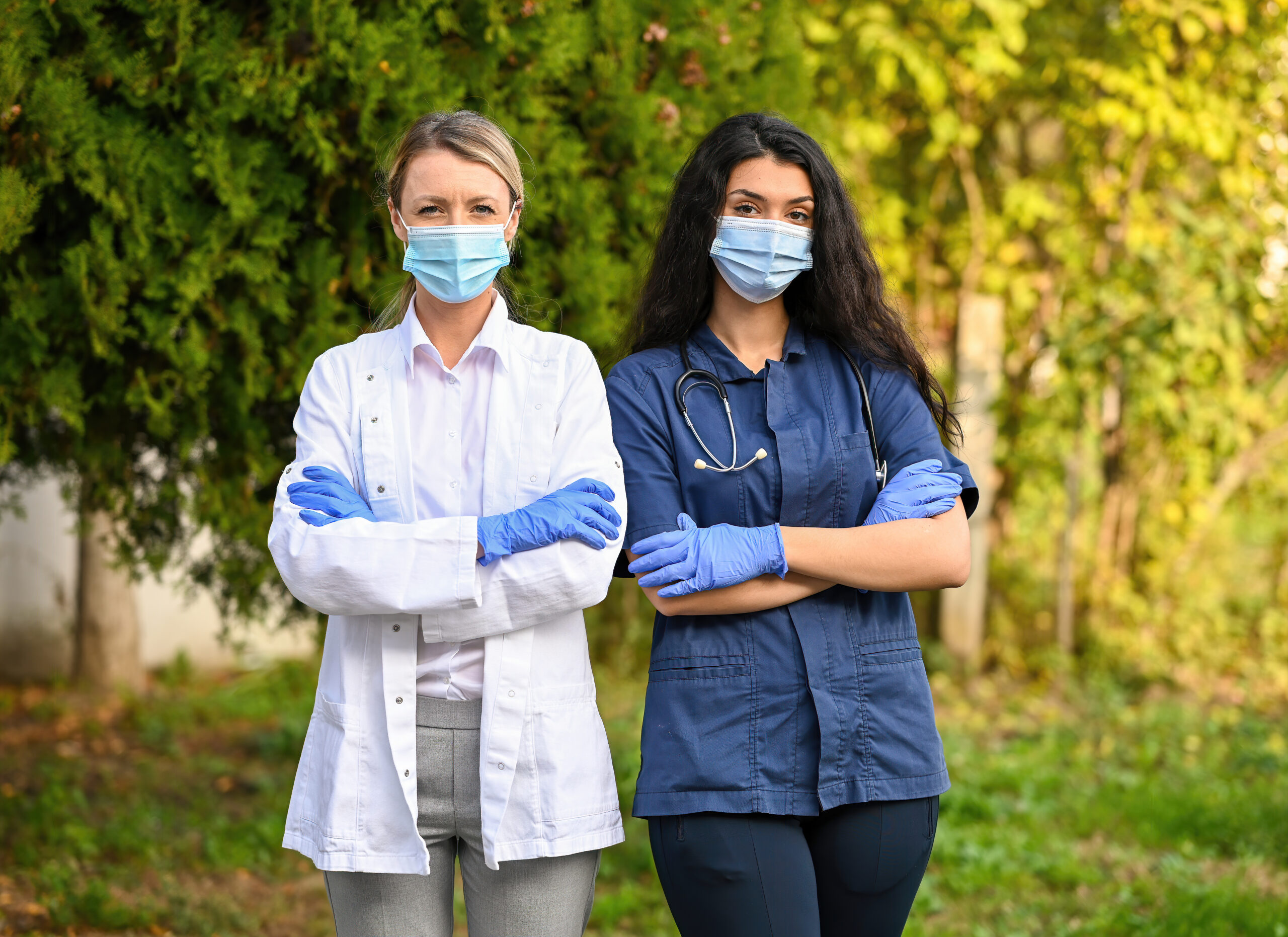female-professionals-wearing-medical-masks-in-outd-2026-03-26-10-07-49-utc