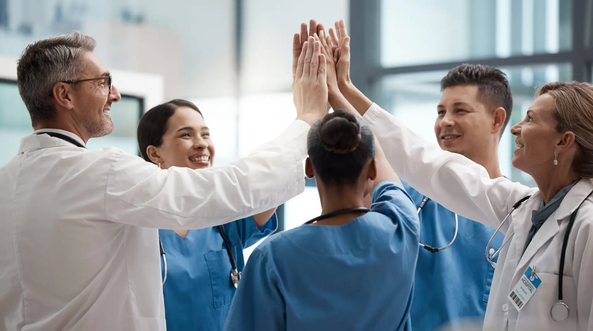 medical-professionals-high-five-celebrating-team-s-2026-01-09-09-56-37-utc