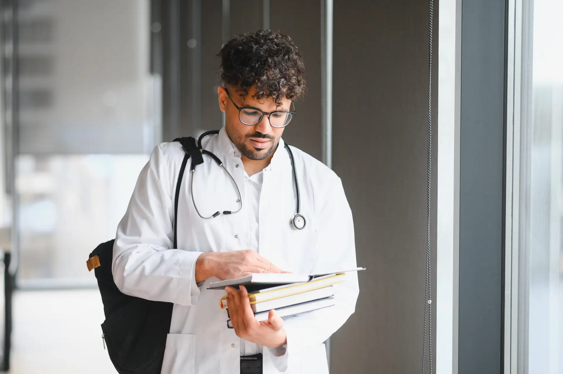 young-medical-student-studying-textbooks-in-univer-2026-03-25-01-21-28-utc